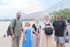 Full-Day-Custom-Kolkata-Tours-Guests-are-in-front-of-the-Howrah-Bridge