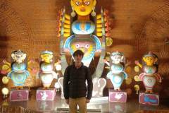 Standing-in-front-of-Goddess-Durga-during-a-Kolkata-City-Tour