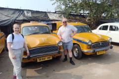 Standing-next-to-Kolkatas-iconic-yellow-Taxi-is-a-classic-way-to-capture-the-timeless-spirit-of-the-City-of-Joy-during-kolkata-