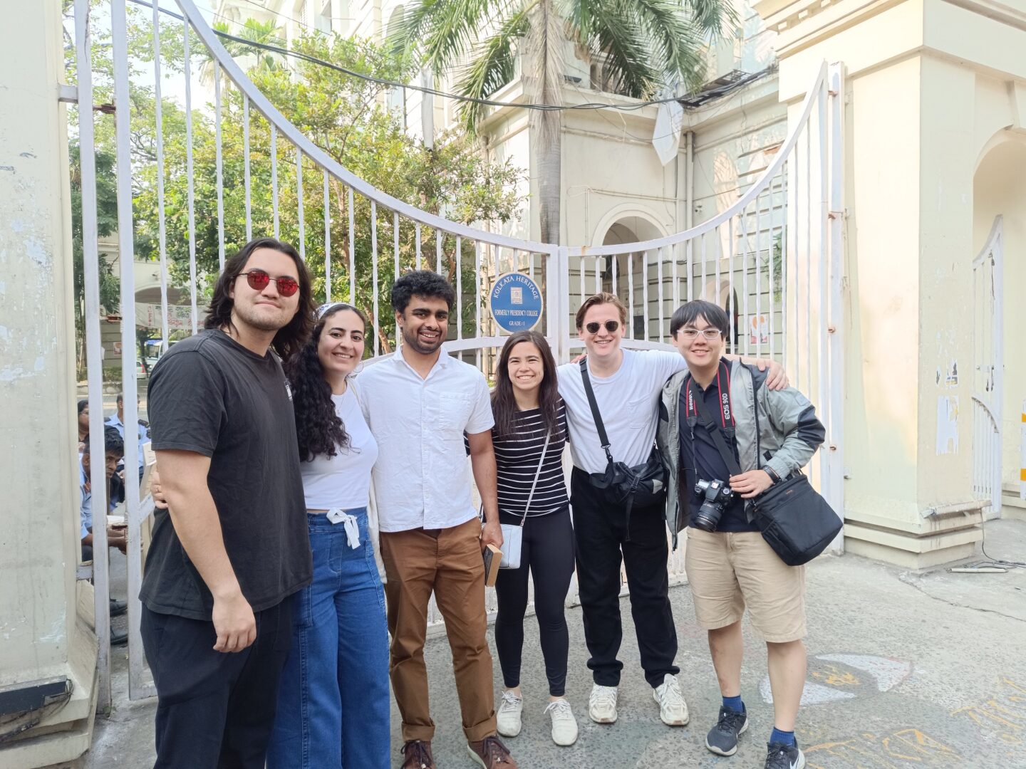 Group photo at university entrance.